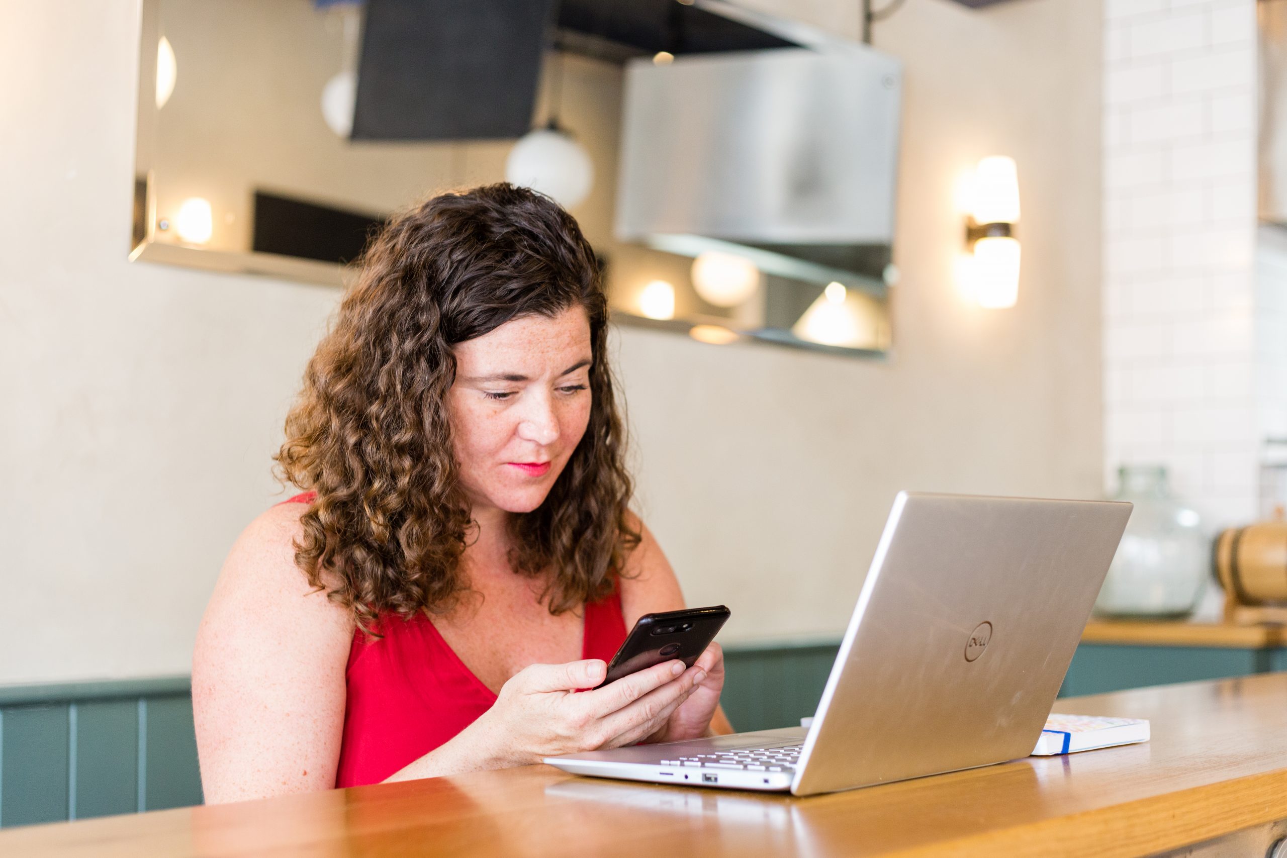 A social media trainer looking at her phone.